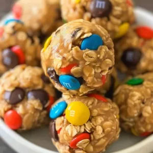 Monster Cookie Protein Balls Recipe 1 Homemade Monster Cookie Protein Balls stacked on a plate