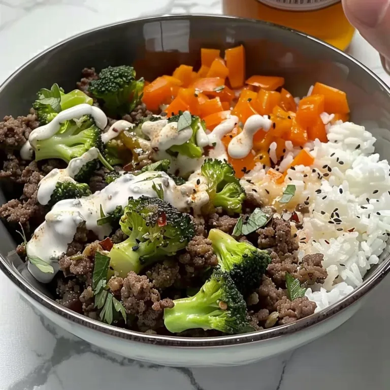 Viral ground beef bowls topped with fresh vegetables and spices in a bowl