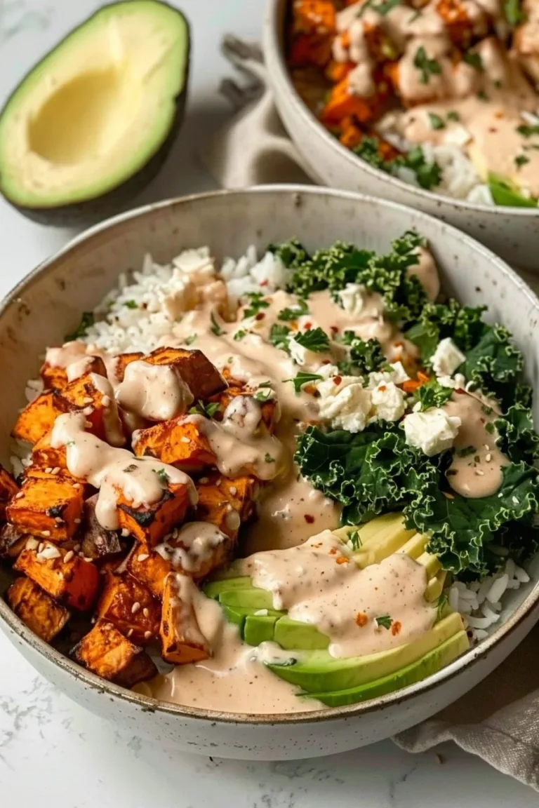Roasted chicken and sweet potato bowls served for two on a rustic table